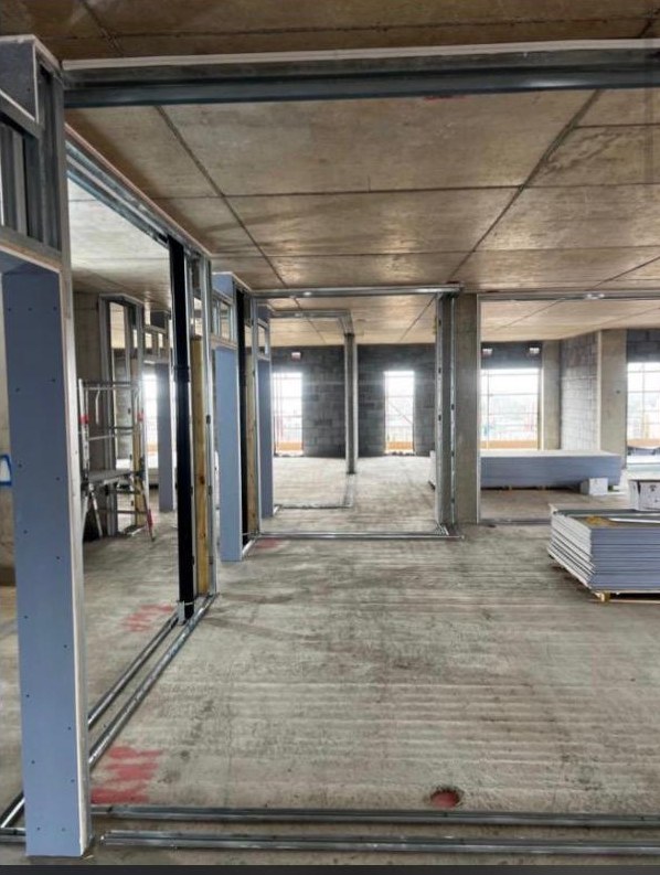 Open-plan floor at Creven House framed out in metal stud ready for boarding