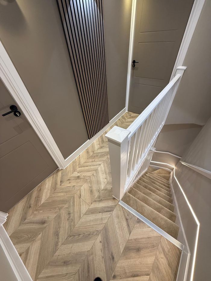 Finished stairwell and landing with slatted feature wall