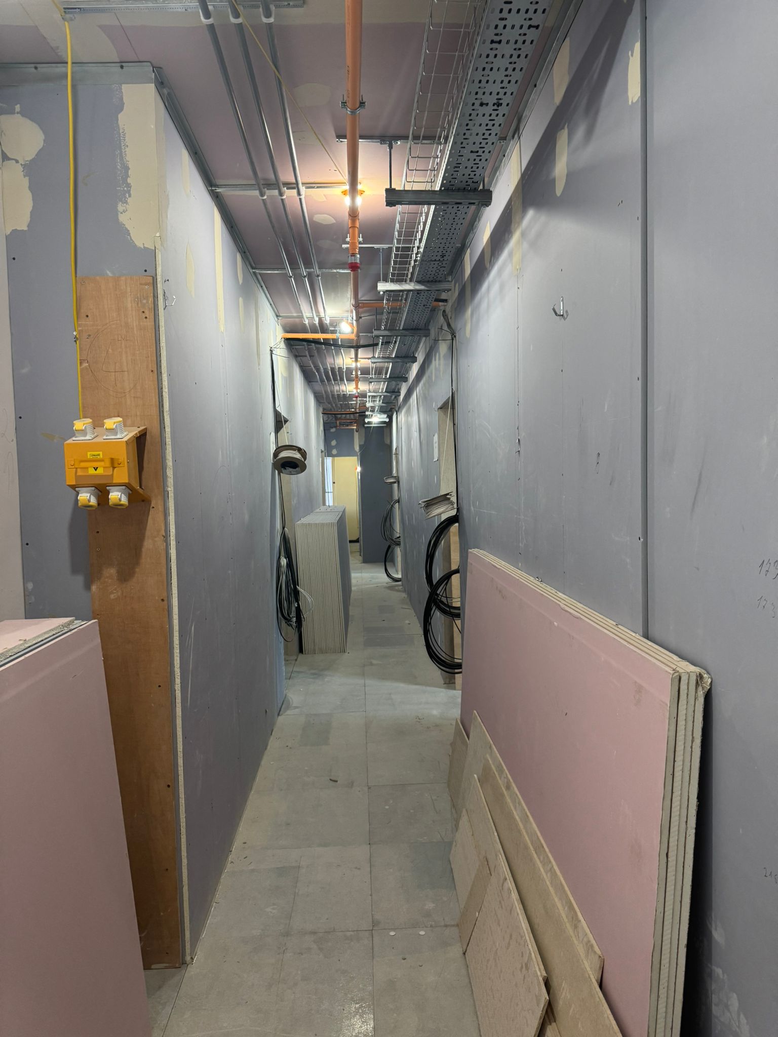 Drylined corridor with cable trays and service runs